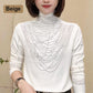 Blouse à manches longues et col montant rembourrée pour femme